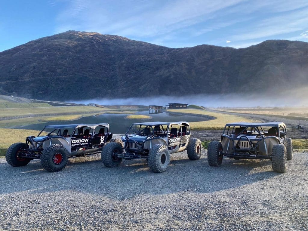 Off road vehicles with terrain in the background