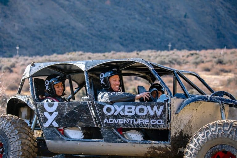 Off-road adventurers with smiles on their faces enjoying a thrilling drive